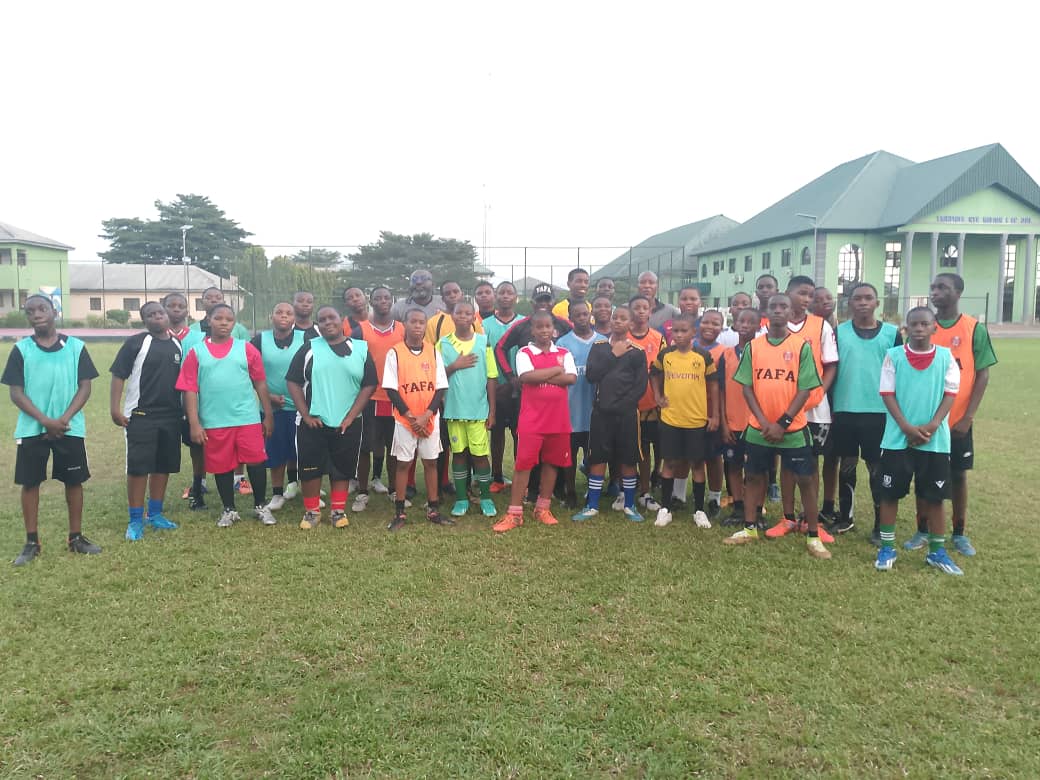 YAFA school development squad gathered on the pitch after a session