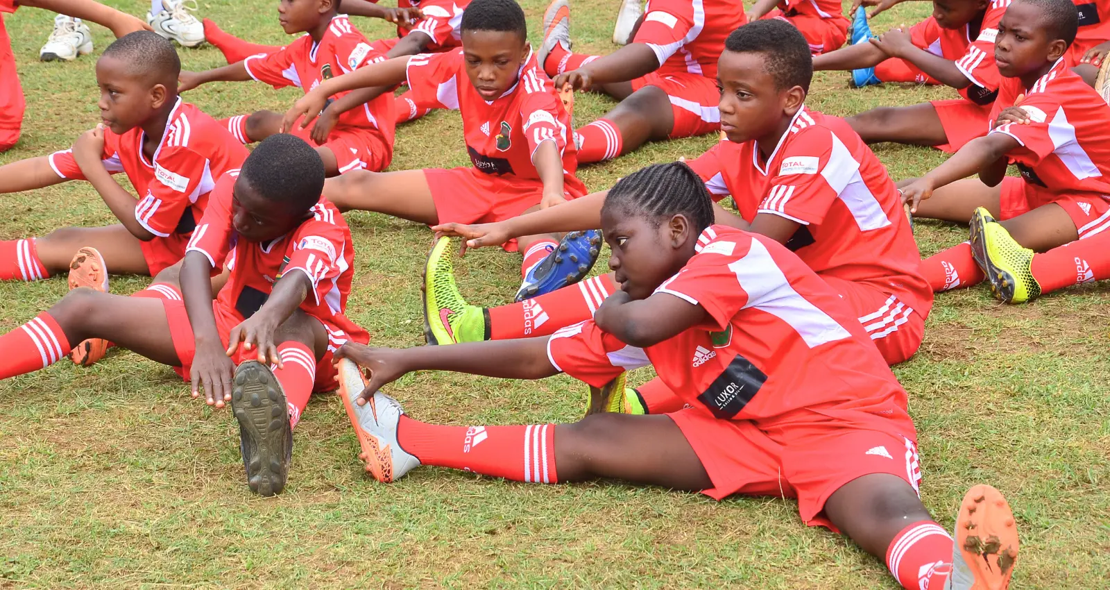 Warm-up stretches on grass