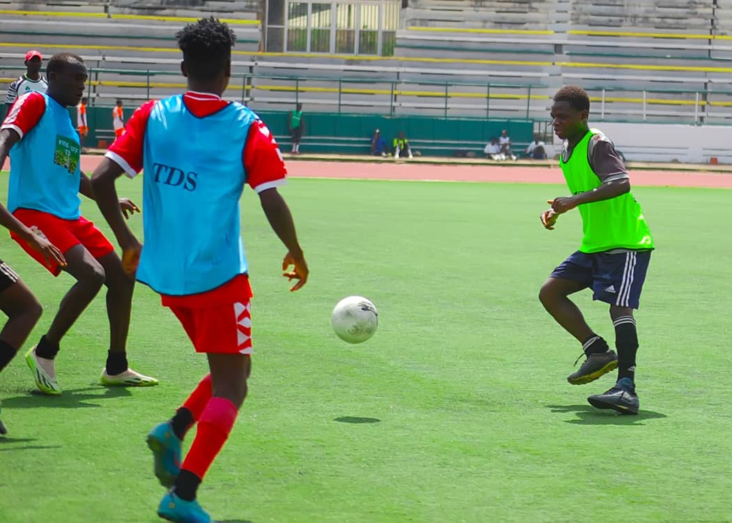 YAFA winger driving at a defender during a TDS fixture